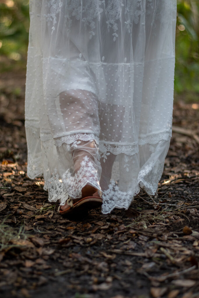 Bride hiking in Hawaii Volcanoes National Park on elopement day