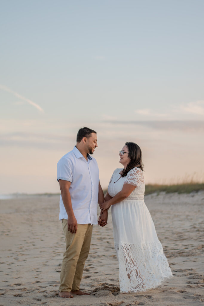 Couple on the beach at sunset in Kona, Hawaii during elopement