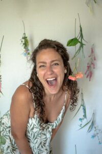 A headshot of a Hawaii elopement photographer and videographer