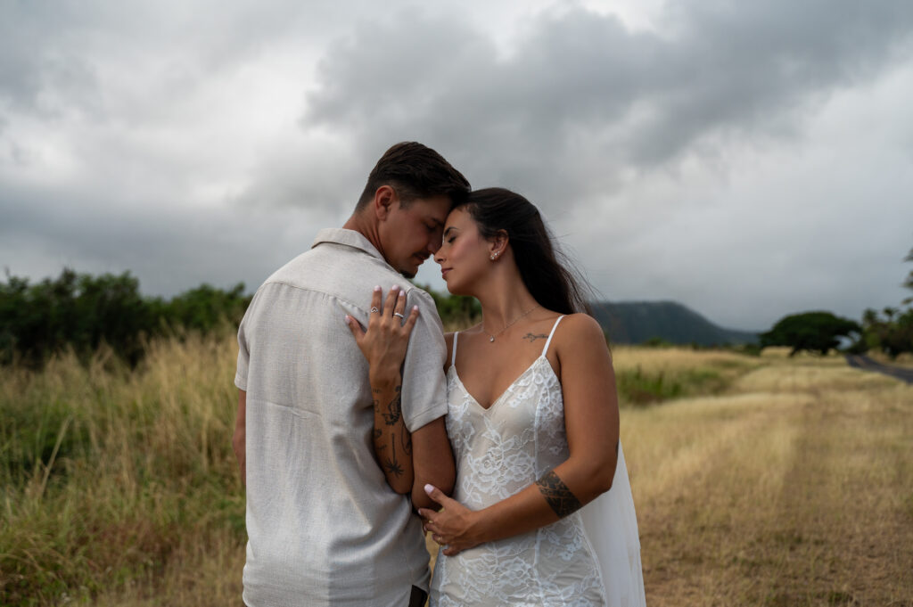 A beautiful couple celebrates their elopement at Punalu'u Black Sand Beach