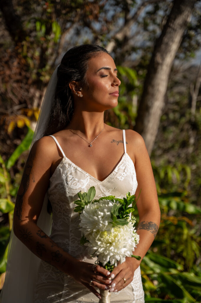 A beautiful couple elopes on in the lush green forest of Hawai'i's Volcano National Park