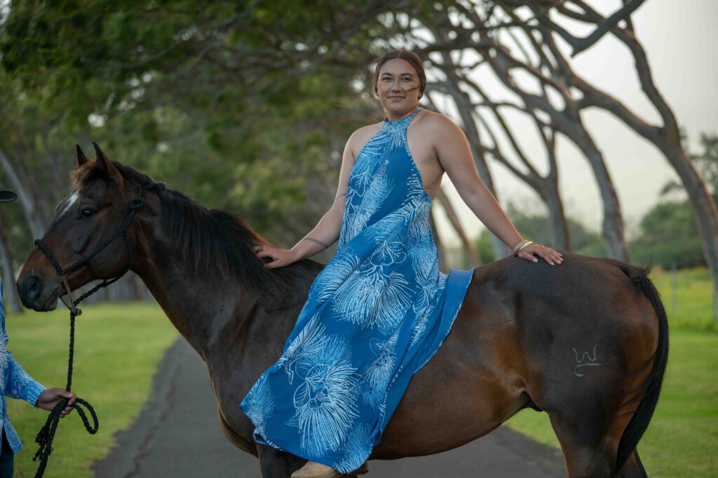 A woman sits on her horse