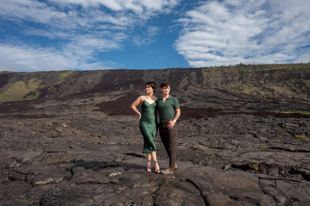 A couple stands on a lava field after a volcano proposal