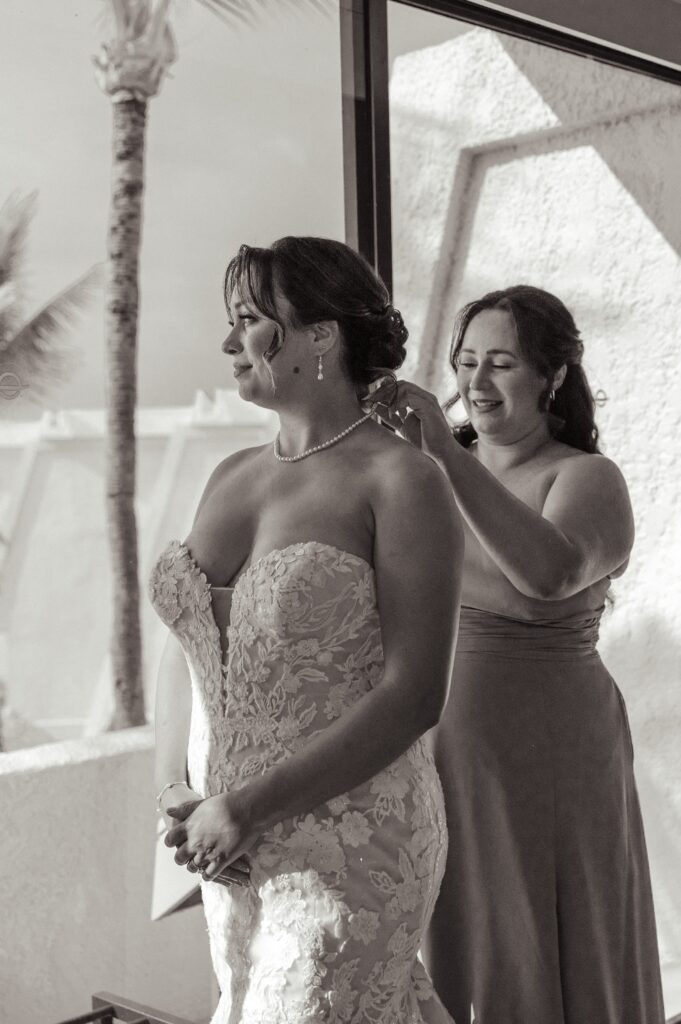 A bride gets ready in her hotel room before her Outrigger Kona wedding
