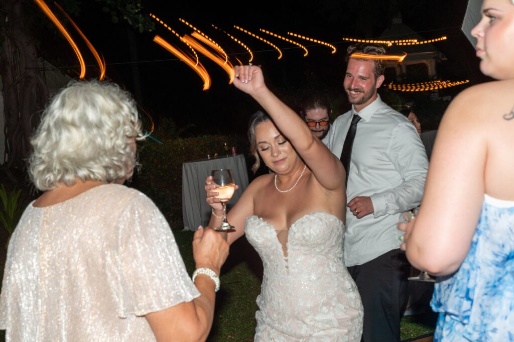 A bride and groom dance in the Helani gardens at their Outrigger Kona wedding