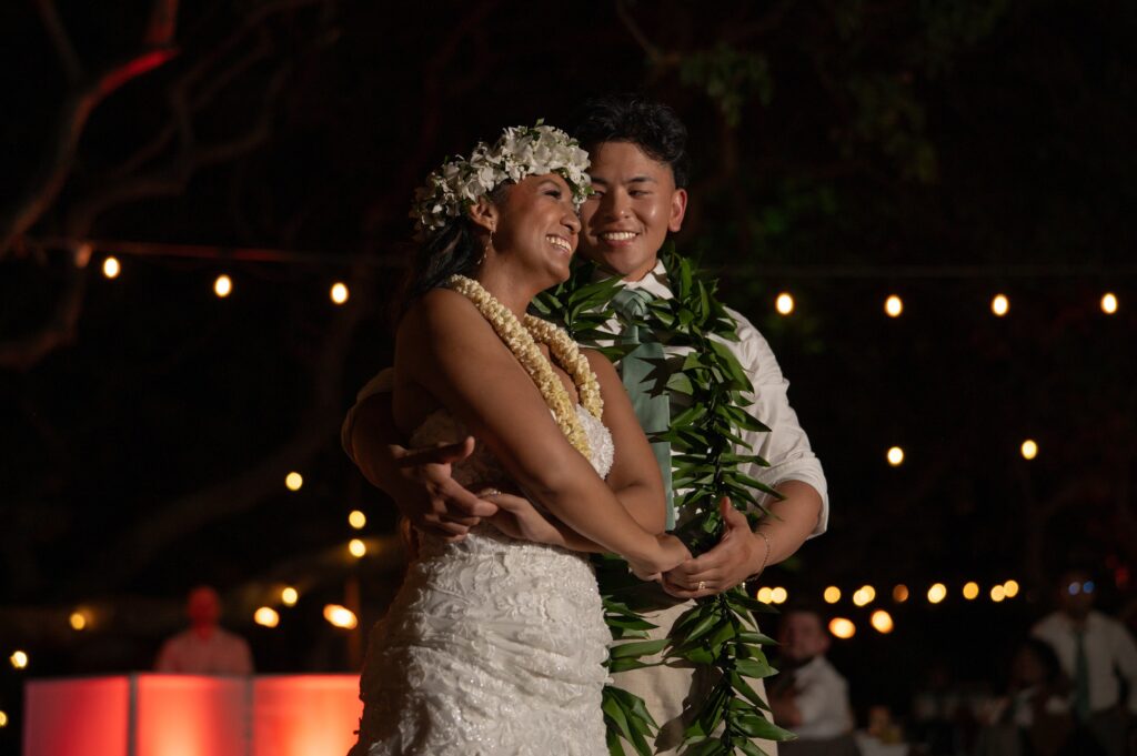 A bride and groom dance together in Helani gardens at their Outrigger Kona wedding